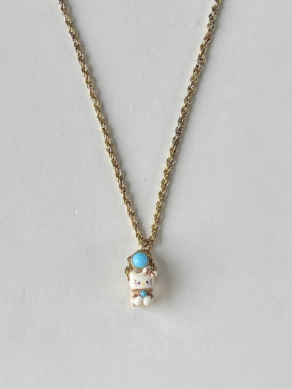 Hello Kitty Gold-Tone Pendant Necklace with Turquoise Accents